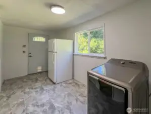 Utility Room with entrance from back patio