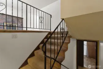 Welcoming entry with access to both upper and lower living areas.