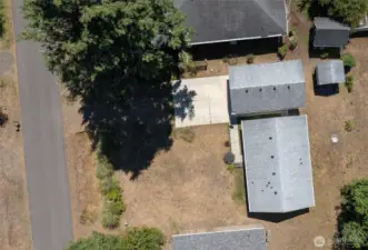 Spacious lot in a quiet neighborhood.  Home entrance is easily wheelchair accessible via the cement driveway and  sidewalk leading to the level front or side door entries.