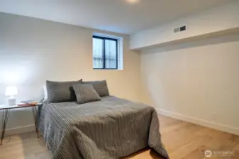 Spacious lower level bedroom has a window for additional light.