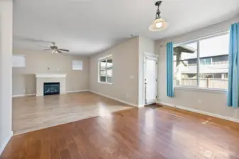 The open concept is so welcoming with the large living room & space for a breakfast table!