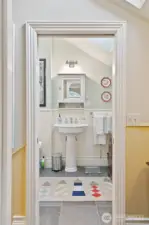 Guest bath across hall from bedroom.