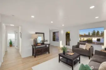 Open layout view showing the living space flowing toward the main hallway, creating a bright connection between rooms.