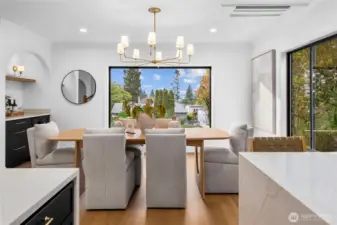 ...another view of the dining space and a very large window with views of the Sound just beyond...