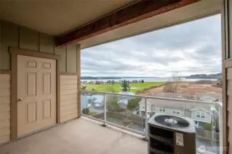 Back porch with amazing view! Door to storage room.