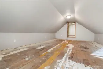 This is the upstairs loft area.The wide-open floor plan, sloped ceilings, and existing access point make it easy to imagine how this space could be reworked over time. Whether used now for overflow storage or gradually improved into a home office, studio, workout area, or bonus room, the square footage is here to support it. This is a true “bring your ideas” space with the potential to become something special as needs evolve.