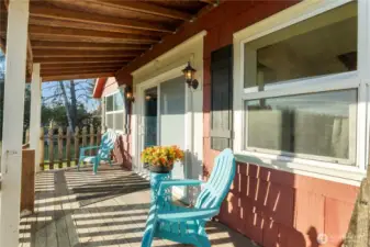 This covered front porch creates a welcoming outdoor living space with room for seating and everyday use. It’s an ideal spot for morning coffee or quiet evenings, offering shelter from the elements while still feeling open and connected to the outdoors. The porch extends the livable space of the home and sets a warm, inviting tone as you arrive.