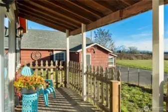 From the porch, the view opens across the property and out toward Mount Rainier, adding a sense of place that’s both calming and memorable. The outlook reinforces the home’s privacy buffer and connection to the surrounding land, while the mountain view provides a natural focal point that changes with the seasons. It’s a feature buyers don’t forget and one that adds daily enjoyment rather than occasional novelty. Rare to find unbostructed views on property this size in town.