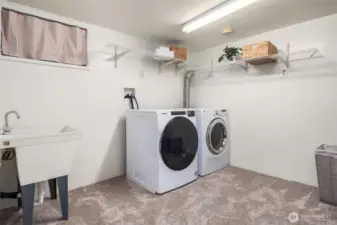 Laundry room & storage in  fully finished basement (all appliances stay)