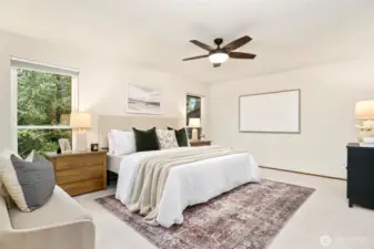 Peaceful primary suite with oversized windows that invite in natural light and serene Northwest views.