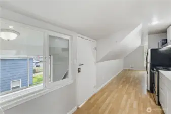 Unit A Kitchen and Stairs Entry.