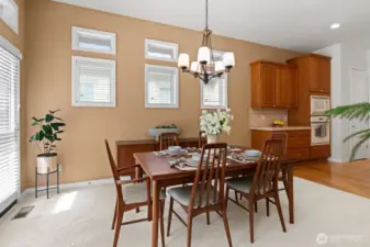 Casual dining area off kitchen offers pleasant views, and access to deck and fenced yard.