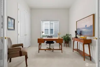 Ideal for a home office, the den with French doors and closet full of custom shelving, is thoughtfully positioned off the entry.