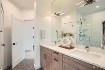 Stunning Primary bath with cabinet to ceiling mirror.