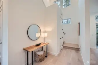 Foyer area offers soaring ceilings to second level.