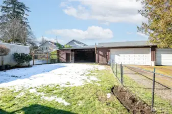 Two car garage with over-sized shop is a huge feature to this North Tacoma home. (The second set of garage doors in the photo belong to the neighbor.)