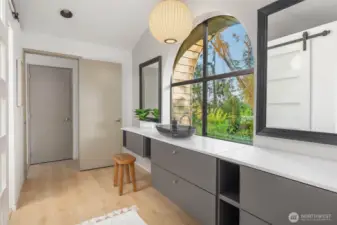 Primary bathroom with large walk-in closet.
