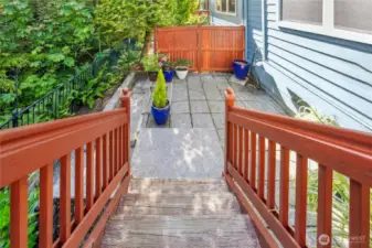 Stairs lead down to the patio