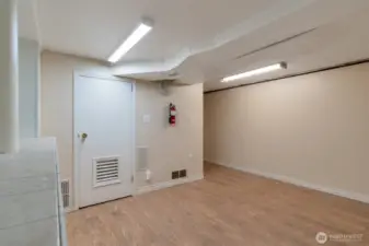 Mechanical room downstairs with newer forced air and water heaters units