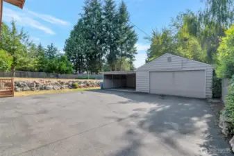 Plenty of parking also available under the carport and in the garage with shop/storage areas in the rear
