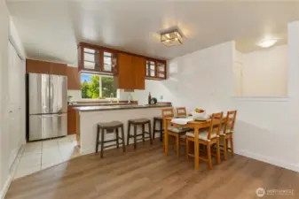 Dining area plus eating bar on kitchen peninsula