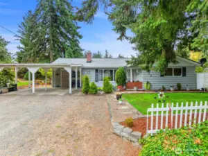 Front view. Double carport with extra parking area. Low maintenance front yard.
