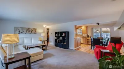 Relax and entertain with ease in this open living area that flows beautifully into the dining room and kitchen.