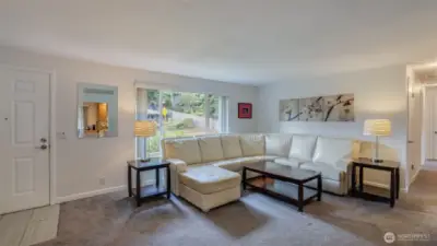 This space is bathed in natural light and features newer carpets.
