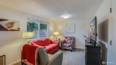 Versatile second living space/flex room, perfect for a cozy lounge, home office, or play area.
