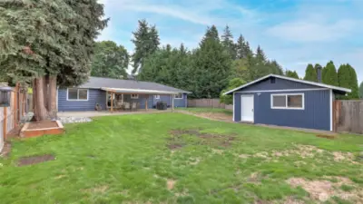Framed by mature trees and fully fenced for added privacy and peace of mind.