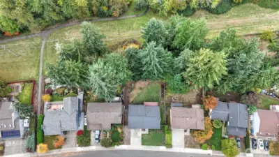 A serene, tree-lined location backing to green space and walking trails for everyday outdoor enjoyment.