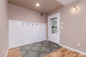 Entry with pegs on the wall for coats.