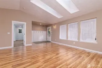 Beautiful big living room with LPV flooring. That's the Primary bedroom off to the left.
