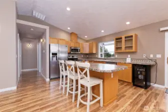 Great-room concept living room and kitchen with a handy breakfast bar.