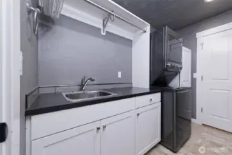 Utility room with a great sink and stacker washer/dryer THAT STAY!