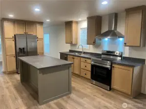 Kitchen with plenty of work area and storage too.