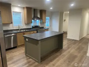 Kitchen looking at hall to bedrooms and utility room.