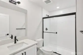Inviting lower level bathroom.  Photo is of similar home-details & finishes will vary-ask site agent for details