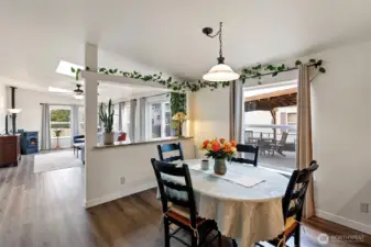 The dining area is designed as an open and inviting space that seamlessly connects to the second living room, creating a comfortable and versatile area for both dining and relaxing.