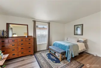 The primary suite is ample size and includes a walk-in closet and attached bath.