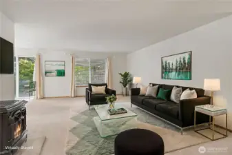 View of your family room, love the large space and gas stove, large windows as well! ***Virtually Staged***