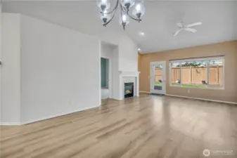 Gas fireplace & big window looks out to the patio ~
