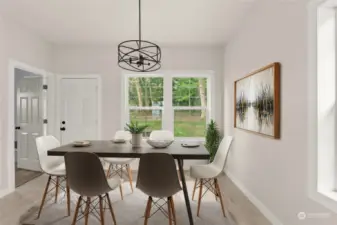 View of spacious dining area.  Primary room off to the left and the closed door leads to the deck and back yard.