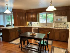 The kitchen has lots of work space, a newer dishwasher, hardwood floors, wall oven, pantry's and lots of room for a potential island.