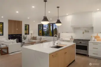 Kitchen with island and workstation sink