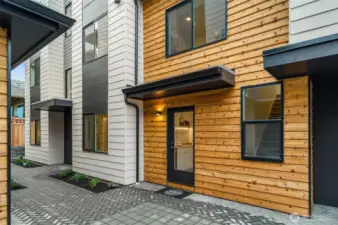 Photos of model home with similar finishes & floor plan. Tucked away in the courtyard, this back entry gives a little more privacy—and a peek into your sparkling kitchen inside!