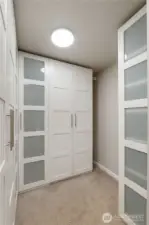 primary closet with storage units.