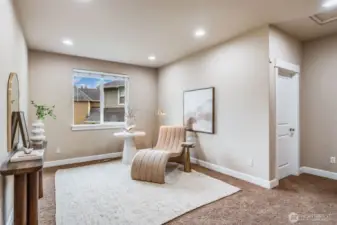 Bright and airy upstairs landing with the perfect cozy nook for reading, working, or winding down. A quiet retreat just steps from the bedrooms.