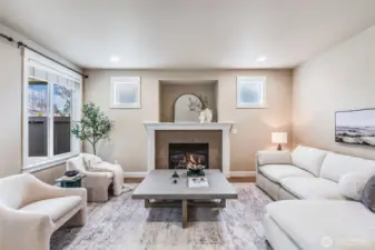 Cozy den showcases a gas fireplace, recessed niche, and stylish modern finishes.