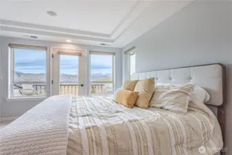 Primary Bedroom with view and balcony